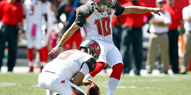 Oct 11, 2015; Tampa, FL, USA; Tampa Bay Buccaneers place kicker Connor Barth kicks his first field goal from the hold of punter Jacob Schum (5) after being re-signed by the Tampa Bay Buccaneers against the Jacksonville Jaguars during the first quarter of an NFL football game at Raymond James Stadium. Mandatory Credit: Reinhold Matay-USA TODAY Sports