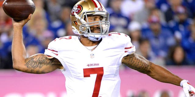 Oct 11, 2015; East Rutherford, NJ, USA; San Francisco 49ers quarterback Colin Kaepernick (7) throws the ball against the New York Giants in the second quarter at MetLife Stadium. Mandatory Credit: Robert Deutsch-USA TODAY Sports
