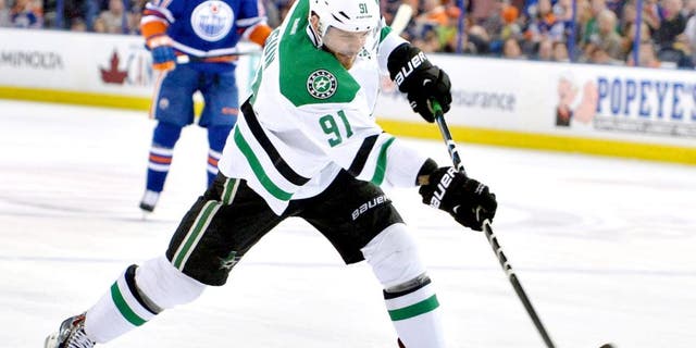 Mar 27, 2015; Edmonton, Alberta, CAN; Dallas Stars center Tyler Seguin (91) takes a slap shot against the Edmonton Oilers in the second period at Rexall Place. Mandatory Credit: Chris LaFrance-USA TODAY Sports