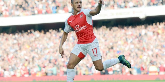 LONDON, ENGLAND - OCTOBER 04: Alexis Sanchez celebrates scoring the 1st Arsenal goal during the Barclays Premier League match between Arsenal and Manchester United at Emirates Stadium on October 4, 2015 in London, England. (Photo by Stuart MacFarlane/Arsenal FC via Getty Images)