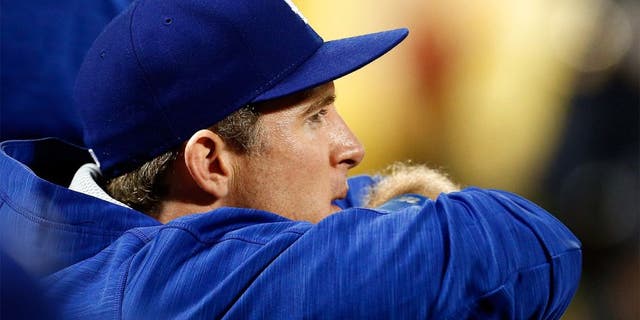 NEW YORK, NY - OCTOBER 12: Chase Utley #26 of the Los Angeles Dodgers looks on from the dugout against the New York Mets during game three of the National League Division Series at Citi Field on October 12, 2015 in New York City. (Photo by Mike Stobe/Getty Images)
