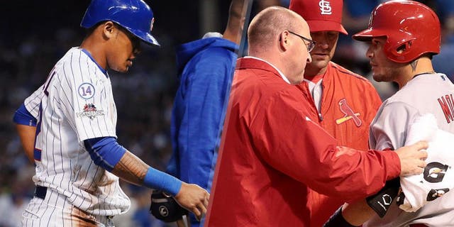 Addison Russell #22 of the Chicago Cubs leaves the field after suffering an apparent injury in the fourth inning against the St. Louis Cardinals during game three of the National League Division Series at Wrigley Field on October 12, 2015 in Chicago, Illinois. (Photo by Jonathan Daniel/Getty Images) Mike Matheny and a Cardinals trainer check on Yadier Molina during the fourth inning on Monday, Oct. 12, 2015, at Wrigley Field in Chicago. (Robert Cohen/St. Louis Post-Dispatch/TNS via Getty Images)