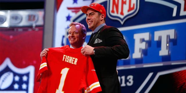 Apr 25, 2013; New York, NY, USA; NFL commissioner Roger Goodell (left) introduces Eric Fisher (Central Michigan) as the number one overall pick to the Kansas City Chiefs during the 2013 NFL Draft at Radio City Music Hall. Mandatory Credit: Jerry Lai-USA TODAY Sports
