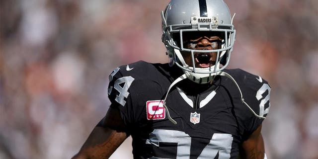 OAKLAND, CA - OCTOBER 11: Charles Woodson #24 of the Oakland Raiders celebrates after an interception against the Denver Broncos during the third quarter at the O.co Coliseum on October 11, 2015 in Oakland, California. (Photo by Thearon W. Henderson/Getty Images)