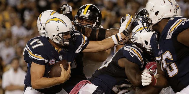 SAN DIEGO, CA - OCTOBER 12: Quarterback Philip Rivers #17 of the San Diego Chargers is pressured by the Pittsburgh Steelers defense at Qualcomm Stadium on October 12, 2015 in San Diego, California. (Photo by Jeff Gross/Getty Images)