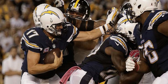 SAN DIEGO, CA - OCTOBER 12: Quarterback Philip Rivers #17 of the San Diego Chargers is pressured by the Pittsburgh Steelers defense at Qualcomm Stadium on October 12, 2015 in San Diego, California. (Photo by Jeff Gross/Getty Images)