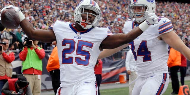 Buffalo Bills running back LeSean McCoy (25) celebrates his touchdown with tight end Nick O'Leary, right, during the first half of an NFL football game against the New England Patriots on Sunday, Oct. 2, 2016, in Foxborough, Mass.