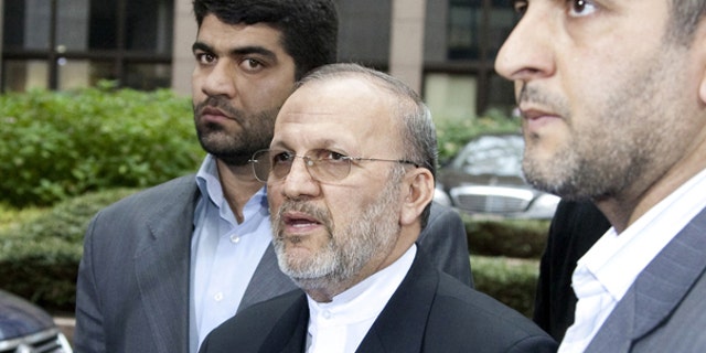 Oct. 15: Iran's Foreign Minister, Manouchehr Mottaki, talks with journalists, prior to the start of a 'Friends of Democratic Pakistan' meeting, at the European Council building in Brussels.