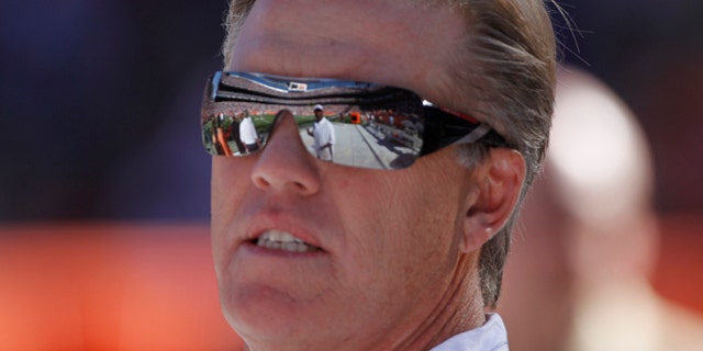 Sept. 26: Former Denver Broncos quarterback John Elway is shown during ceremonies honoring Floyd Little at halftime of a Denver Broncos game against the Indianapolis Colts, in Denver.