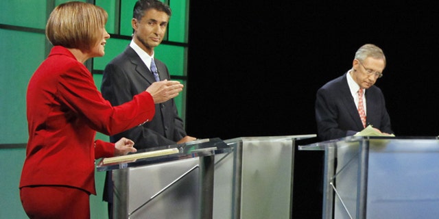 Oct. 14: Republican Senate candidate Sharron Angle, left debates Senate Majority Leader Harry Reid in Las Vegas.