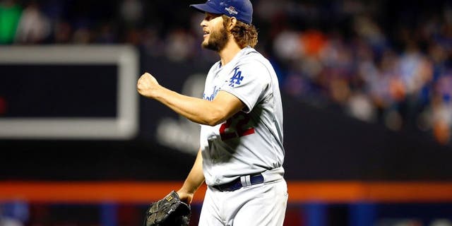 NEW YORK, NY - OCTOBER 13: Clayton Kershaw #22 of the Los Angeles Dodgers react after closing out the seventh inning against the New York Mets during game four of the National League Division Series at Citi Field on October 13, 2015 in New York City. (Photo by Mike Stobe/Getty Images)