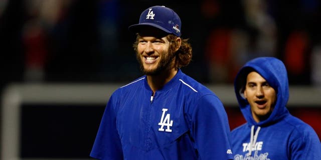 NEW YORK, NY - OCTOBER 13: Clayton Kershaw #22 of the Los Angeles Dodgers smiles after defeating the New York Mets in game four of the National League Division Series at Citi Field on October 13, 2015 in New York City. The Dodgers defeated the Mets with a score of 3 to 1. (Photo by Mike Stobe/Getty Images)
