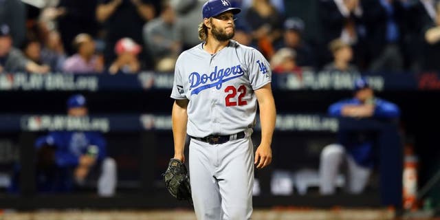 NEW YORK, NY - OCTOBER 13: Clayton Kershaw #22 of the Los Angeles Dodgers reacts against the New York Mets during game four of the National League Division Series at Citi Field on October 13, 2015 in New York City. (Photo by Elsa/Getty Images)