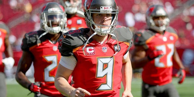 TAMPA, FL - DECEMBER 28: Michael Koenen #9 of the Tampa Bay Buccaneers is seen as he runs onto the field during an NFL football game against the New Orleans Saints at Raymond James Stadium on December 28, 2014 in Tampa, Florida. (Photo by Alex Menendez/Getty Images)