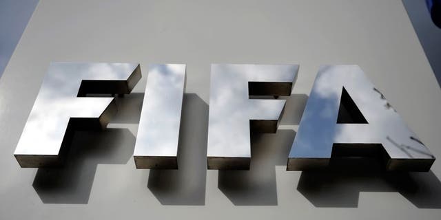 ZURICH, SWITZERLAND - OCTOBER 09: A FIFA logo next to the entrance at the FIFA headquarters on October 9, 2015 in Zurich, Switzerland. On Thursday, FIFA's Ethics Committee provisionally banned FIFA President Joseph S. Blatter from all football activities for the duration of 90 days. (Photo by Harold Cunningham/Getty Images)
