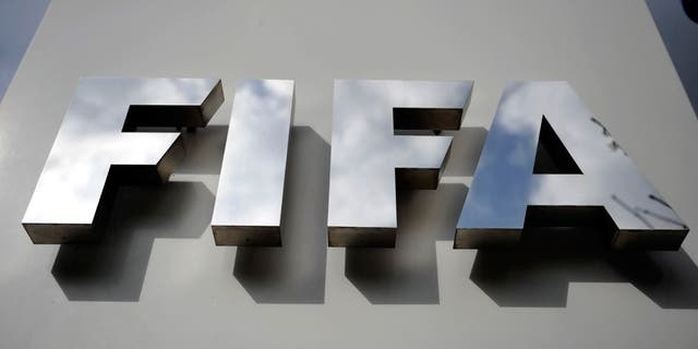 ZURICH, SWITZERLAND - OCTOBER 09: A FIFA logo next to the entrance at the FIFA headquarters on October 9, 2015 in Zurich, Switzerland. On Thursday, FIFA's Ethics Committee provisionally banned FIFA President Joseph S. Blatter from all football activities for the duration of 90 days. (Photo by Harold Cunningham/Getty Images)