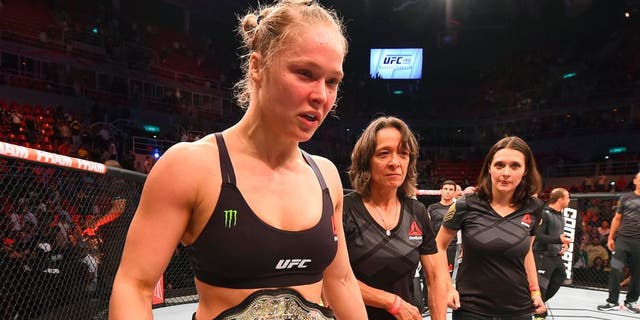 RIO DE JANEIRO, BRAZIL - AUGUST 01: Ronda Rousey of the United States celebrates her knock out victory over Bethe Correia of Brazil in the first round in their UFC women's bantamweight championship bout during the UFC 190 event inside HSBC Arena on August 1, 2015 in Rio de Janeiro, Brazil. (Photo by Josh Hedges/Zuffa LLC/Zuffa LLC via Getty Images)