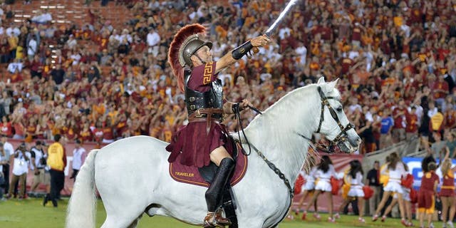Sep 5, 2015; Los Angeles, CA, USA; Southern California Trojans white horse mascot Traveler with rider Hector Aguilar during the game against the Arkansas State Red Wolves at Los Angeles Memorial Coliseum. Mandatory Credit: Kirby Lee-USA TODAY Sports