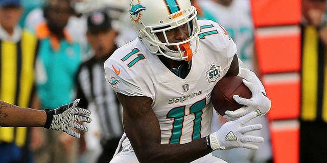 MIAMI GARDENS, FL - SEPTEMBER 27: DeVante Parker #11 of the Miami Dolphins is defended by Anthony Dixon #26 of the Buffalo Bills during a game at Sun Life Stadium on September 27, 2015 in Miami Gardens, Florida. (Photo by Mike Ehrmann/Getty Images)