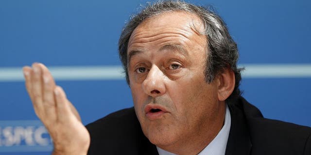 UEFA chief Michel Platini gestures as he speaks during a UEFA press conference after the draw for the UEFA Europa League football group stage 2015/16 on August 28, 2015 in Monaco. AFP PHOTO / VALERY HACHE (Photo credit should read VALERY HACHE/AFP/Getty Images)