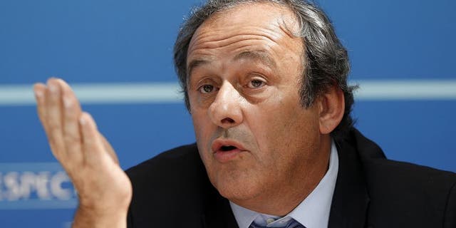 UEFA chief Michel Platini gestures as he speaks during a UEFA press conference after the draw for the UEFA Europa League football group stage 2015/16 on August 28, 2015 in Monaco. AFP PHOTO / VALERY HACHE (Photo credit should read VALERY HACHE/AFP/Getty Images)