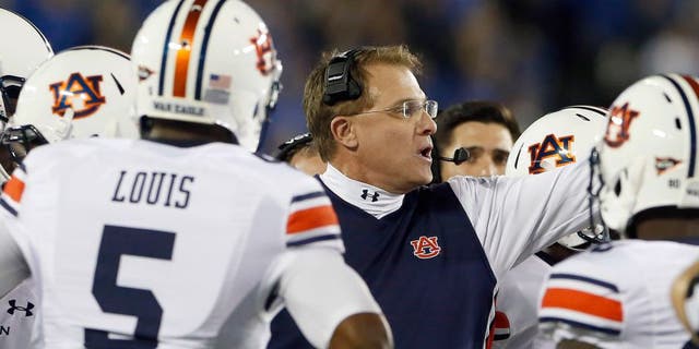 Oct 15, 2015; Lexington, KY, USA; Auburn Tigers head coach Gus Malzahn coaches his team against the Kentucky Wildcats in the first quarter at Commonwealth Stadium. Mandatory Credit: Mark Zerof-USA TODAY Sports