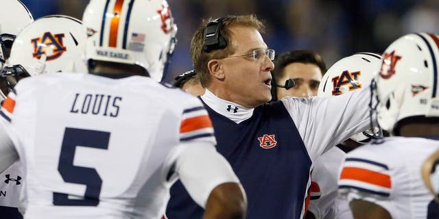 Oct 15, 2015; Lexington, KY, USA; Auburn Tigers head coach Gus Malzahn coaches his team against the Kentucky Wildcats in the first quarter at Commonwealth Stadium. Mandatory Credit: Mark Zerof-USA TODAY Sports