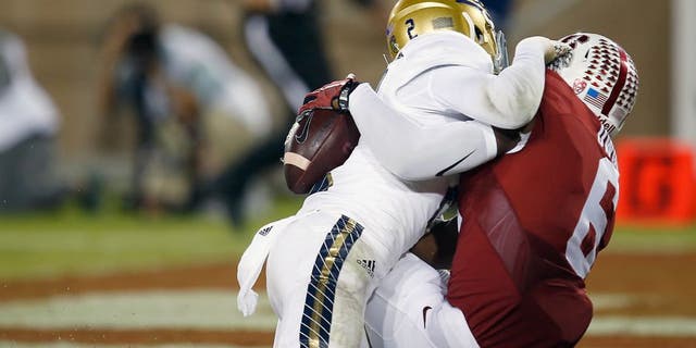 Stanford wide receiver Francis Owusu, right, catches a touchdown pass behind the back of UCLA defensive back Jaleel Wadood during the second half of an NCAA college football game Thursday, Oct. 15, 2015, Stanford, Calif. (AP Photo/Tony Avelar)