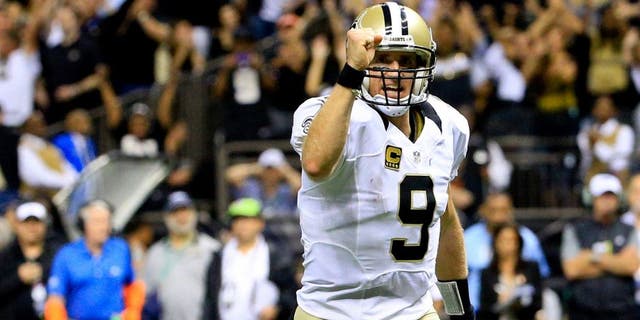 Oct 15, 2015; New Orleans, LA, USA; New Orleans Saints quarterback Drew Brees (9) celebrates after a touchdown run by running back Mark Ingram (not pictured) during the fourth quarter of a game at the Mercedes-Benz Superdome. Mandatory Credit: Derick E. Hingle-USA TODAY Sports