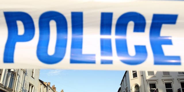 WHITEHAVEN, ENGLAND - JUNE 2: Duke Street in Whitehaven is cordoned off to the public with police-tape for a scene of a murder caused by gunman Derrick Bird on June 2, 2010 in Whitehaven, England. 12 people have been shot dead and a further 25 people injured after a 52 year old man named as Derrick Bird went on a rampage with a shotgun in Cumbria before killing himself. (Photo by Oli Scarff/Getty Images)