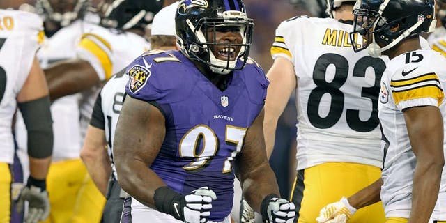 Sep 11, 2014; Baltimore, MD, USA; Baltimore Ravens tackle Timmy Jernigan (97) reacts following his tackle against the Pittsburgh Steelers at M&T Bank Stadium. Mandatory Credit: Mitch Stringer-USA TODAY Sports