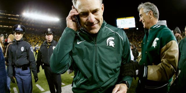 ANN ARBOR, MI - OCTOBER 17: Head coach Mark Dantonio of the Michigan State Spartans walks off the field after defeating the Michigan Wolverines 27-23 in the college football game at Michigan Stadium on October 17, 2015 in Ann Arbor, Michigan. (Photo by Christian Petersen/Getty Images)