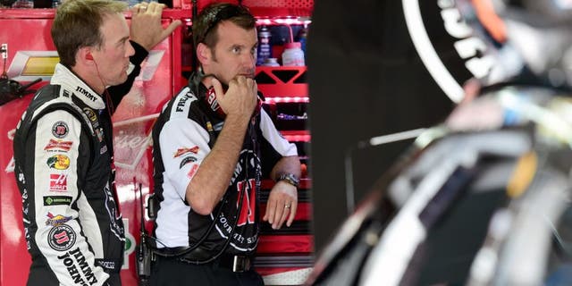 CHARLOTTE, NC - OCTOBER 08: Kevin Harvick, driver of the #4 Jimmy John's/Budweiser Chevrolet, and his crew chief Rodney Childers look on during practice for the NASCAR Sprint Cup Series Bank of America 500 at Charlotte Motor Speedway on October 8, 2015 in Charlotte, North Carolina. (Photo by Jared C. Tilton/NASCAR via Getty Images)