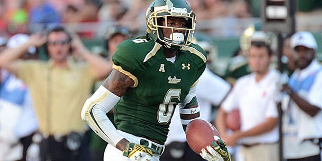 Sep 13, 2014; Tampa, FL, USA; South Florida Bulls defensive back Lamar Robbins (6) returns an interception for a touchdown in the second half against the North Carolina State Wolfpack at Raymond James Stadium. Mandatory Credit: Jonathan Dyer-USA TODAY Sports