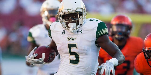 Oct 10, 2015; Tampa, FL, USA; South Florida Bulls running back Marlon Mack (5) runs for a touchdown in the third quarter against the Syracuse Orange at Raymond James Stadium. The South Florida Bulls won 45-24. Mandatory Credit: Logan Bowles-USA TODAY Sports