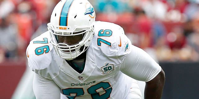 Sep 13, 2015; Landover, MD, USA; Miami Dolphins offensive tackle Branden Albert (76) lines up against the Washington Redskins at FedEx Field. Mandatory Credit: Geoff Burke-USA TODAY Sports