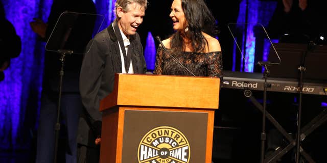 From left, artist Randy Travis and wife Mary Travis as the Country Music Hall of Fame Medallion Ceremony at the Country Music Hall of Fame and Museum on Sunday, Oct. 16, 2016 in Nashville, Tenn.