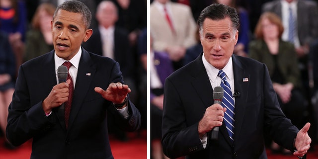 Oct. 16, 2012: President Barack Obama, left, and Republican presidential nominee Mitt Romney address the audience during the second presidential debate at Hofstra University.