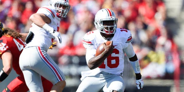 Oct 4, 2014; College Park, MD, USA; Ohio State Buckeyes quarterback J.T. Barrett (16) runs with the ball during the second quarter against the Maryland Terrapins at Byrd Stadium. Mandatory Credit: Tommy Gilligan-USA TODAY Sports