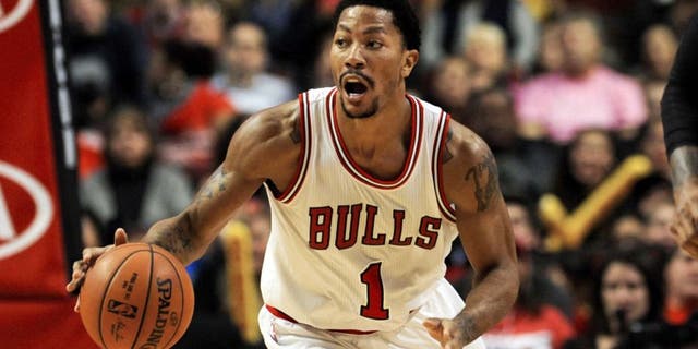 Oct 16, 2014; Chicago, IL, USA; Chicago Bulls guard Derrick Rose (1) during the first half of their pre-season game against the Atlanta Hawks at the United Center. Mandatory Credit: Matt Marton-USA TODAY Sports
