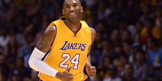 Kobe Bryant smiles during a game