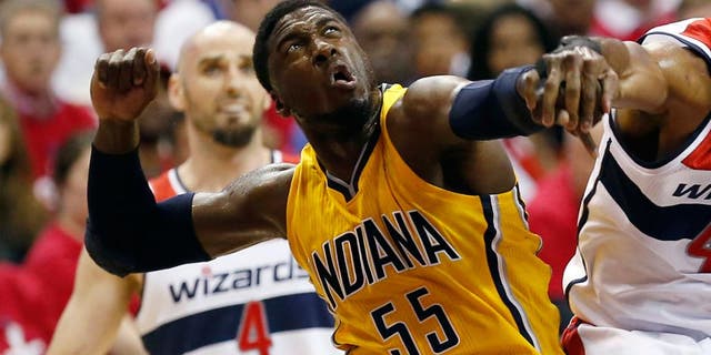 May 15, 2014; Washington, DC, USA; Indiana Pacers center Roy Hibbert (55) blocks the shot of Washington Wizards forward Nene (42) in the first quarter in game six of the second round of the 2014 NBA Playoffs at Verizon Center. Mandatory Credit: Geoff Burke-USA TODAY Sports