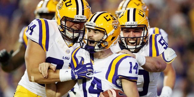 BATON ROUGE, LA - OCTOBER 17: Trent Domingue #14 of the LSU Tigers celebrates after scoring a touchdown on a fake field goal against the Florida Gators at Tiger Stadium on October 17, 2015 in Baton Rouge, Louisiana. (Photo by Chris Graythen/Getty Images)