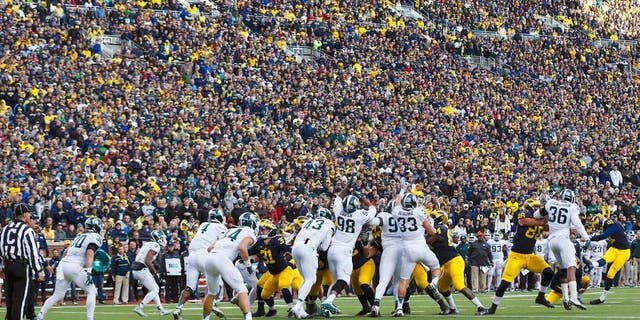 Oct 17, 2015; Ann Arbor, MI, USA; Michigan Wolverines place kicker Kenny Allen (91) kicks a field goal in the third quarter against the Michigan State Spartans at Michigan Stadium. Mandatory Credit: Rick Osentoski-USA TODAY Sports
