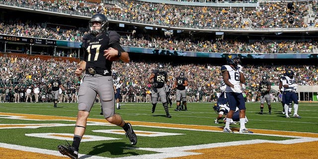 WACO, TX - OCTOBER 17: Seth Russell #17 of the Baylor Bears scores a touchdown against the West Virginia Mountaineers in the second quarter at McLane Stadium on October 17, 2015 in Waco, Texas. (Photo by Tom Pennington/Getty Images)