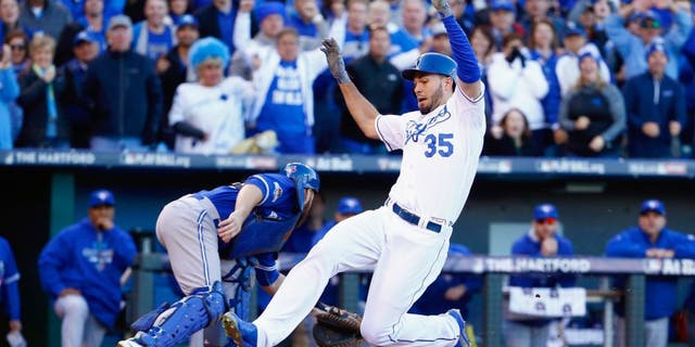 Eric Hosmer #35 of the Kansas City Royals scores a run in the seventh inning against the Toronto Blue Jays in game two of the American League Championship Series at Kauffman Stadium on October 17, 2015 in Kansas City, Missouri. (Photo by Jamie Squire/Getty Images)