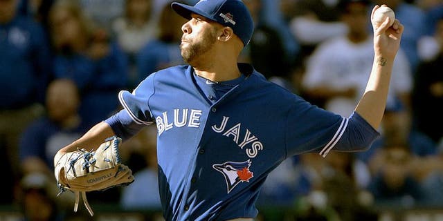 Oct 17, 2015; Kansas City, MO, USA; Toronto Blue Jays starting pitcher David Price (14) pitches during the first inning against the Kansas City Royals in game two of the ALCS at Kauffman Stadium. Mandatory Credit: Denny Medley-USA TODAY Sports
