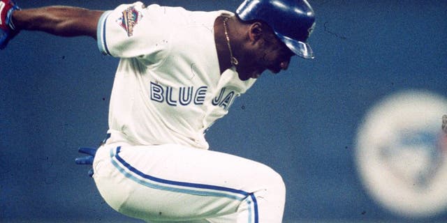 TORONTO, ON - OCTOBER 23: Joe Carter #29 of the Toronto Blue Jays celebrates after hitting a walk off home run in the ninth inning during Game Six of the 1993 World Series at the Toronto SkyDome on October 23, 1993 in Toronto, Ontario, Canada. (Photo by MLB Photos)