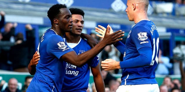 LIVERPOOL, ENGLAND - OCTOBER 04: Romelu Lukaku (L) of Everton celebrates with Tyias Browning (C) of Everton and Ross Barkley (R) of Everton after scoring Everton's first goal during the Barclays Premier League match between Everton and Liverpool at Goodison Park on October 4, 2015 in Liverpool, England. (Photo by Dean Mouhtaropoulos/Getty Images)