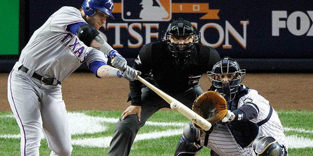 Oct. 18: Rangers' Josh Hamilton hits a two run home run off New York Yankees starting pitcher Andy Pettitte in the first inning of Game 3 of the ALCS, in New York.